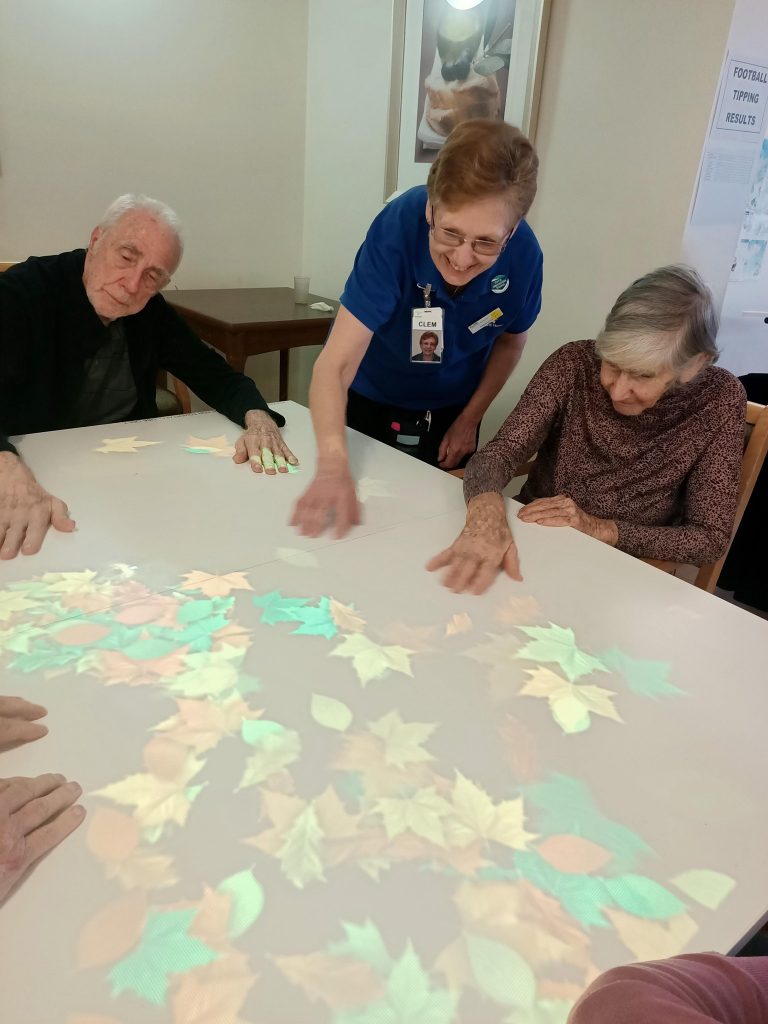 staff and residents using the tovertafel at North Adelaide