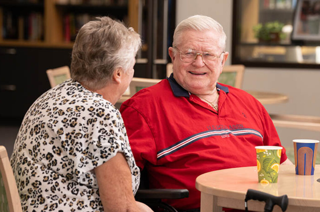 Woman and man chatting in cafe area