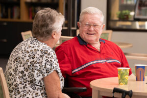 Woman and man chatting in cafe area