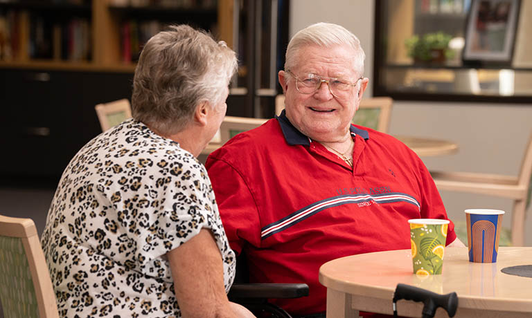 Woman and man chatting in cafe area