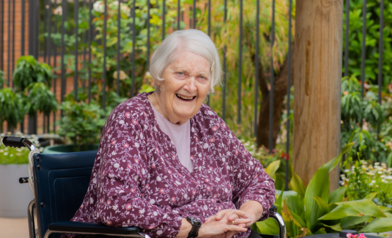 Elderly woman in wheelchair. See home care package calculator.