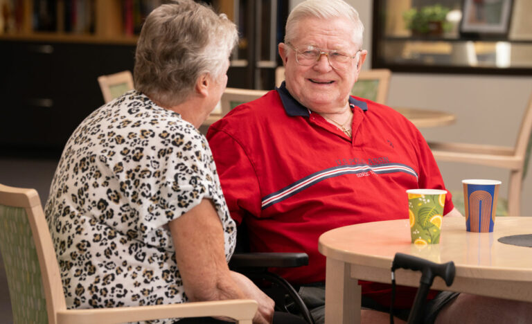 Man and woman talking at table